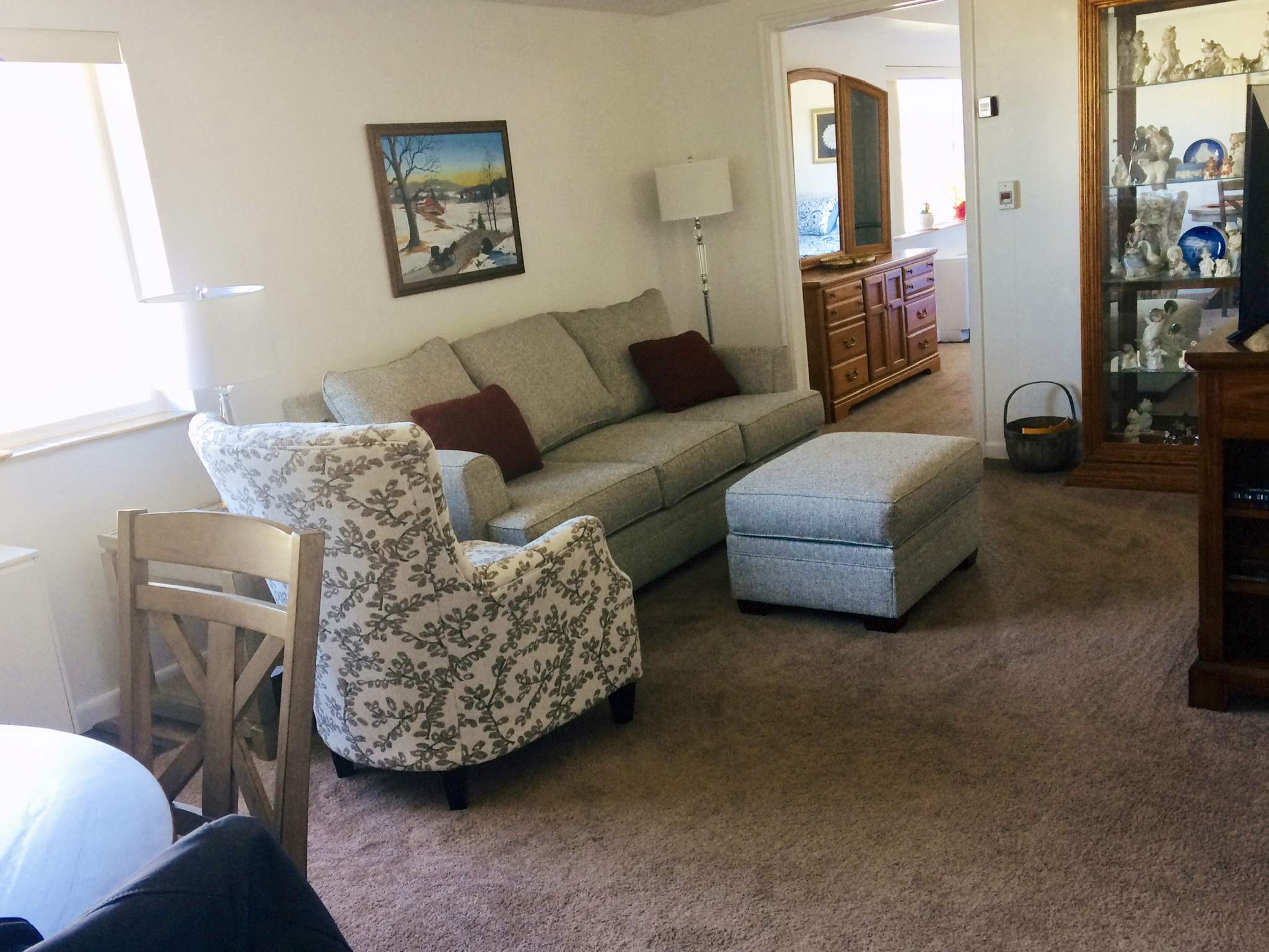 a living room with a couch and a chair